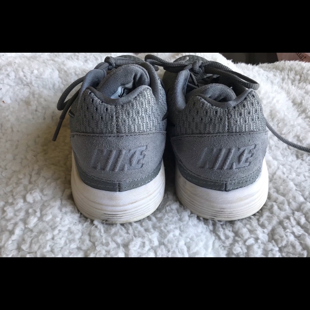 A gray pair of Nike Sneakers